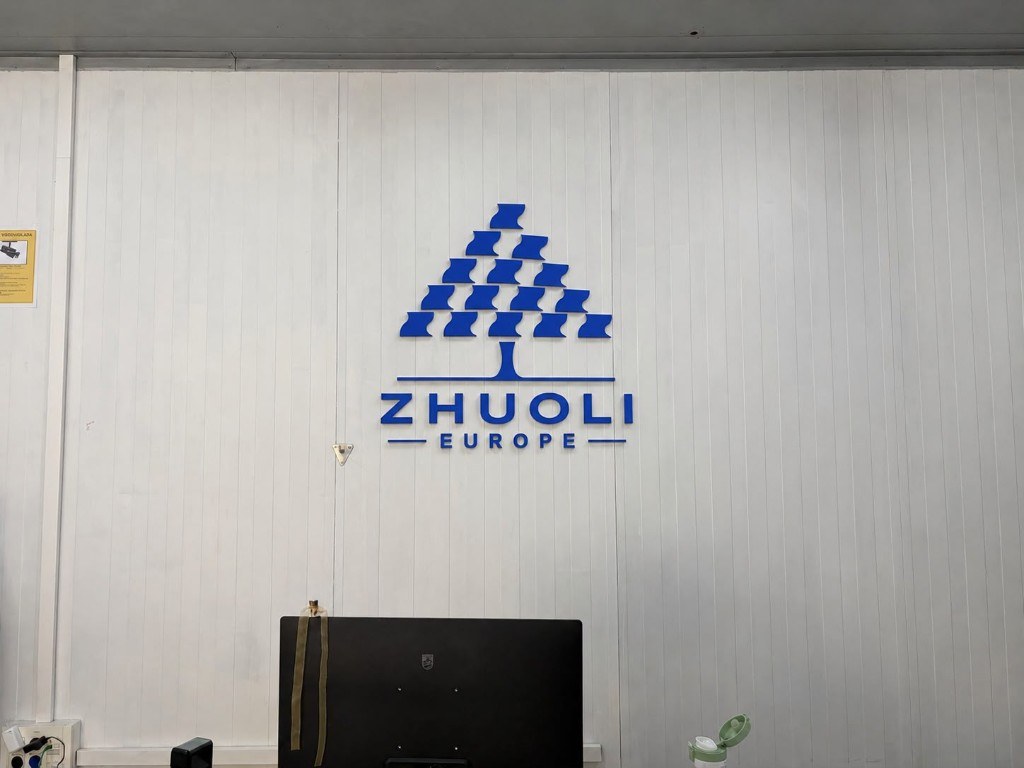 Zhuoli Europe logo displayed on an interior wall